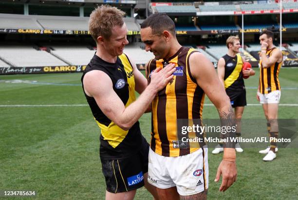 Jack Riewoldt of the Tigers and Shaun Burgoyne of the Hawks embrace after the 2021 AFL Round 23 match between the Richmond Tigers and the Hawthorn...