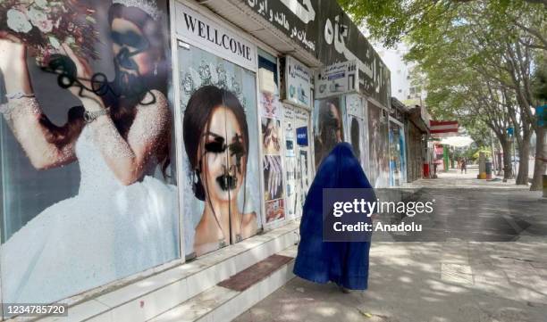 Women posters on beauty salon windows remain vandalized in Kabul, Afghanistan on August 20, 2021.