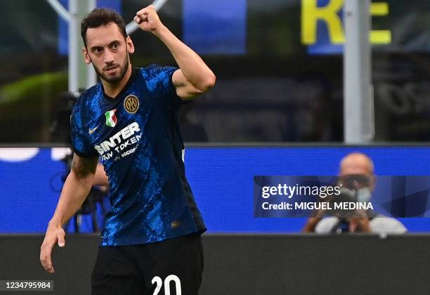 Inter Milan's Turkish midfielder Hakan Calhanoglu celebrates during the Italian Serie A football match Inter Milan vs Genoa at San Siro stadium in...