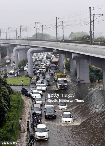 Heavy traffic jam due to water logging after heavy rain on the road connecting Dwarka and Dhaula Kuan, on August 21, 2021 in New Delhi, India.