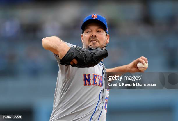 Starting pitcher Rich Hill of the New York Mets throws a pitch against the Los Angeles Dodgers during the first inning at Dodger Stadium on August...