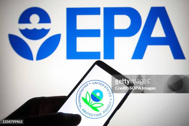 In this photo illustration, Environmental Protection Agency logo of the U.S. Is seen displayed on a smartphone and a pc screen.