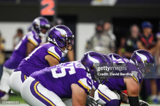 Kellen Mond of the Minnesota Vikings calls the play at the line of scrimmage against the Indianapolis Colts in the third quarter of a preseason game...