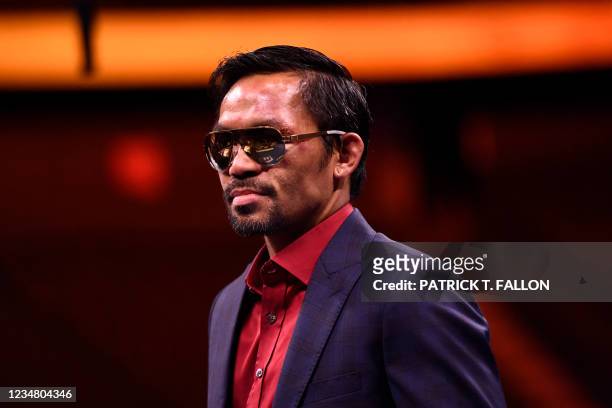 Manny Pacquiao of the Philippines speaks during a press conference after his defeat to Yordenis Ugas of Cuba in the WBA Welterweight Championship...