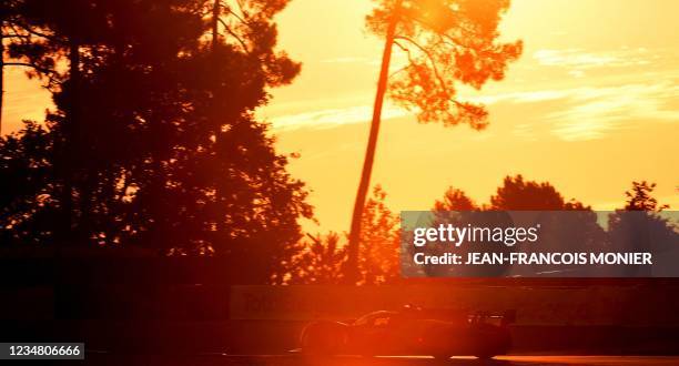 Toyota TS050 Hybrid Hypercar WEC's British driver Mike Conway steers during the 89th edition of the Le Mans 24 Hours endurance race, on August 21 in...