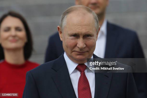 Russian President Vladimir Putin smiles during the ceremony marking the Flag Day in front of the Victory Museum at Poklonnaya Hill, on August 22 in...