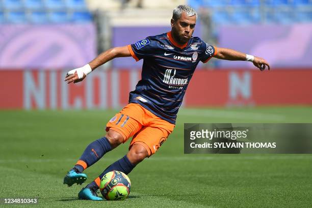 Montpellier's French midfielder Teji Savanier drives the ball during the French L1 football match between Montpellier Herault SC and FC Lorient at...