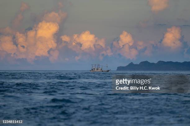 Fishing boat is seen on August 20, 2021 in New Taipei City, Taiwan. Taiwan used to have 300 boats using the traditional fire fishing method but now...