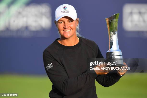 Sweden's Anna Nordqvist poses with the trophy after her victory in the Women's British Open, after a final round 69 at Carnoustie, Scotland on August...