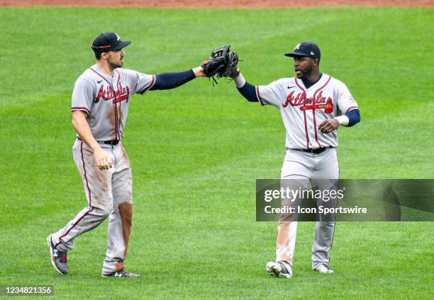 Atlanta Braves left fielder Adam Duvall celebrates with Atlanta Braves center fielder Guillermo Heredia following the Atlanta Braves game versus the...