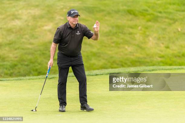 Rod Pampling of Australia acknowledges the crowd after sinking his putt on the 18th green during the final round of the Boeing Classic at The Club at...
