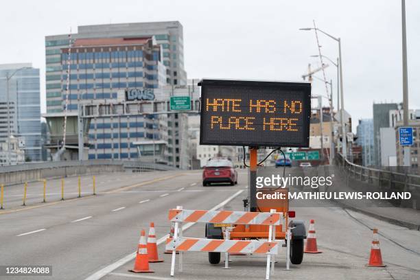 Traffic sign displays a message on the Morrison Bridge ahead of opposing rallies between far-right groups and anti-fascist activists on August 22,...