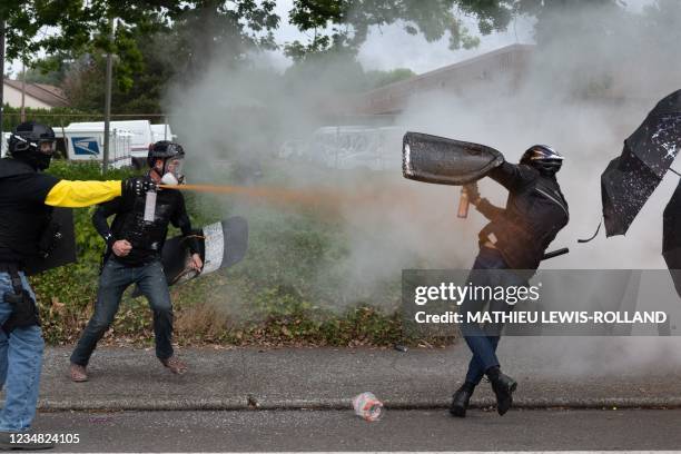 Members of the Proud Boys clash with anti-fascist activists following a far-right rally on August 22, 2021 in Portland, Oregon. - Far-right groups,...