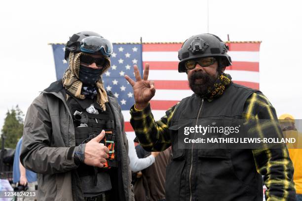 Members of the Proud Boys pose for a photograph during a far-right rally on August 22, 2021 in Portland, Oregon. - Far-right groups, including the...