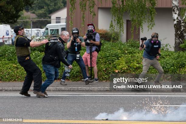 Members of the Proud Boys clash with anti-fascist activists during a far-right rally on August 22, 2021 in Portland, Oregon. - Far-right groups,...