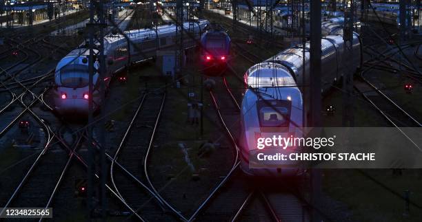 High speed trains of German railway operator Deutsche Bahn are seen at the main railway station in Munich, southern Germany, on August 23, 2021...