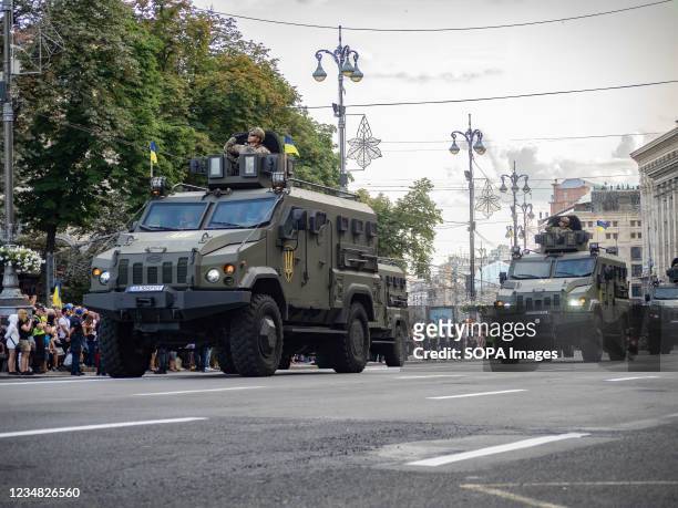 Ukrainian military vehicles drive in formation during the rehearsal of the military parade which will take place on the Independence Day.