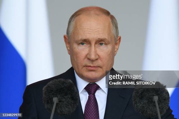 Russian President Vladimir Putin delivers a speech during the opening ceremony of the International Military-Technical Forum "Army-2021" held in the...
