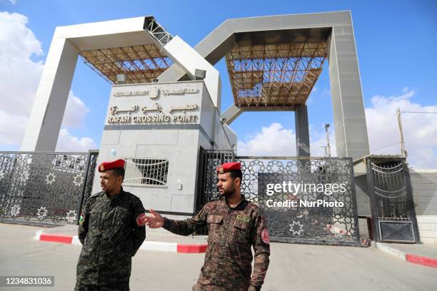 Members of Palestinan security forces stand guard at the closed off Rafah border crossing to Egypt in the southern Gaza Strip, on August 23, 2021....