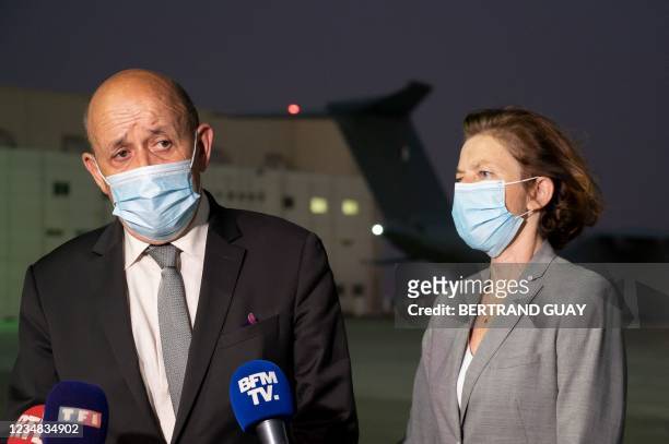French European and Foreign Affairs Minister Jean-Yves Le Drian and French Defence Minister Florence Parly talk to the press at the French military...