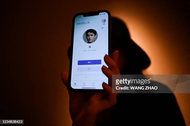 This picture taken on July 16, 2021 shows Melissa showing her virtual boyfriend - a chatbot created by XiaoIce, a cutting-edge artificial...