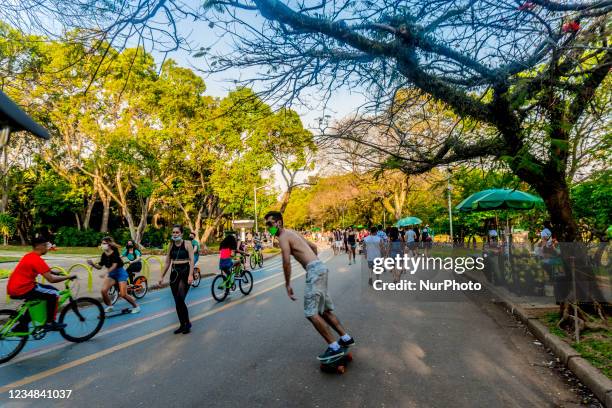 People enjoy a sunny and warm day at Ibirapuera Park in Sao Paulo, Brazil, on August 23, 2021. Air humidity is below 25% in the city of SP and city...