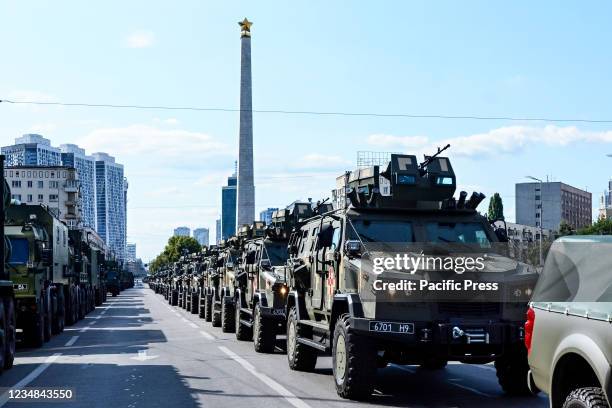 Ukrainian military vehicles drive in formation during the rehearsal of military parade in preparation for the upcoming Independence Day on August 24...