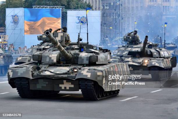 Ukrainian military vehicles drive in formation in a rehearsal of military parade in preparation for the upcoming Independence Day on August 24 at...