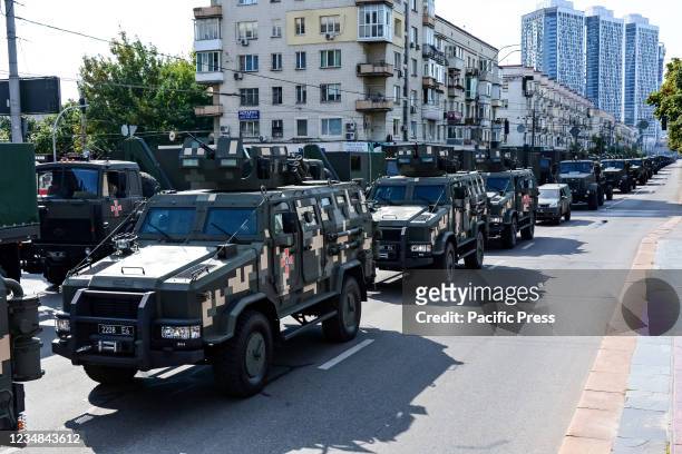 Ukrainian military vehicles drive in formation during the rehearsal of military parade in preparation for the upcoming Independence Day on August 24...
