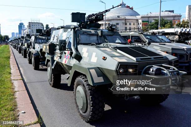 Ukrainian military vehicles drive in formation during the rehearsal of military parade in preparation for the upcoming Independence Day on August 24...