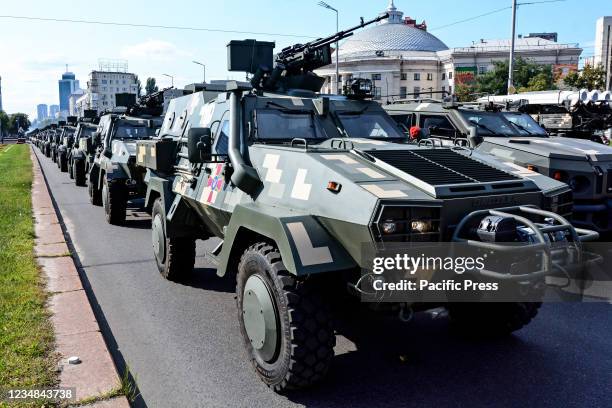 Ukrainian military vehicles drive in formation during the rehearsal of military parade in preparation for the upcoming Independence Day on August 24...