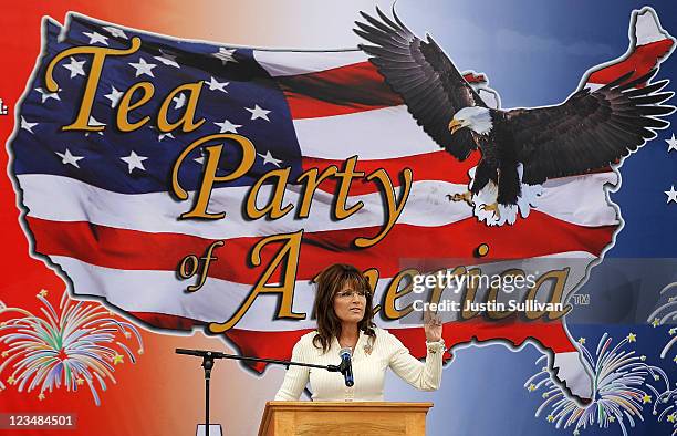 Former Alaska governor Sarah Palin speaks during the Tea Party of America's "Restoring America" event at the Indianola Balloon Festival Grounds on...