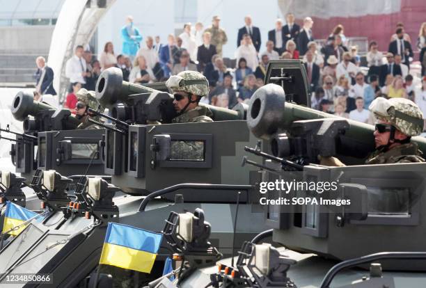 Ukrainian servicemen are seen holding Javelin anti-tank missiles during the Independence Day military parade on the Independence Square in downtown...