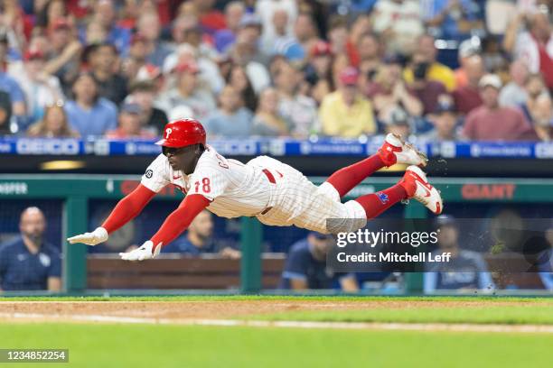 Didi Gregorius of the Philadelphia Phillies slides home safely in the bottom of the fourth inning against the Tampa Bay Rays at Citizens Bank Park on...
