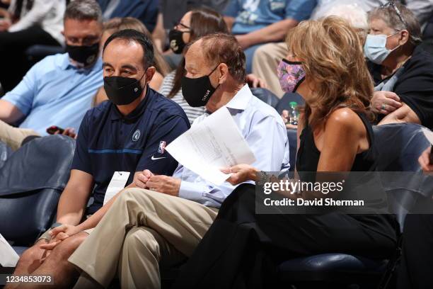 Minnesota Lynx owner, Glen Taylor and Wife, Becky Mulvihill talk to President of Basketball Operations Gersson Rosas during the game between the...