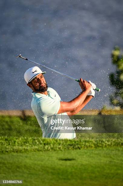 Tony Finau plays a shot from a greenside bunker on the 18th hole during the final round of THE NORTHERN TRUST, the first event of the FedExCup...