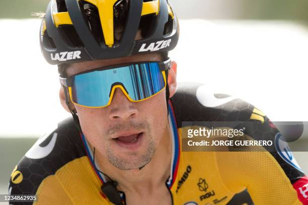 Team Jumbo's Slovenian rider Primoz Roglic crosses the finish line as he wins the 11th stage of the 2021 La Vuelta cycling tour of Spain, a 133.6 km...
