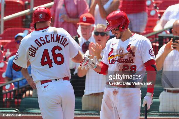 Nolan Arenado of the St. Louis Cardinals congratulates Paul Goldschmidt of the St. Louis Cardinals after Goldschmidt hit his second home run of the...