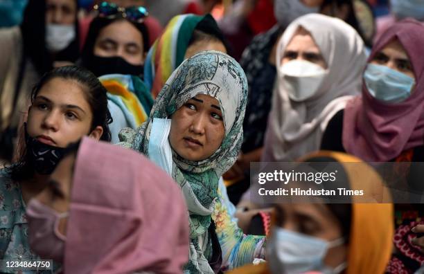 Afghan refugees seen during a protest to urge the international community to help Afghan refugees outside United Nations High Commissioner for...