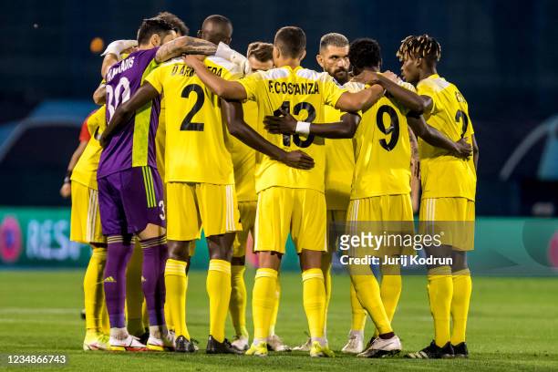 Players of FC Sheriff embrace before the UEFA Champions League Play-Offs Leg Two match between Dinamo Zagreb and FC Sheriff at Maksimir Stadium on...
