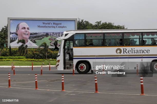 Billboard featuring the Reliance Industries Ltd. Founder Dhirajlal Ambani at an entry gate to the company's oil refinery in Jamnagar, Gujarat, India,...