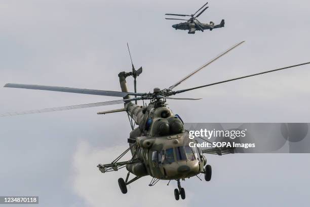 Russian Air Force Mil Mi-8 and Kamov Ka-52 "Alligator" attack helicopter fly during the annual Army Games defense technology international...