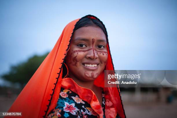 The Wayuu indigenous girl is seen wearing the traditional dress of the community before the Yonna Dance, also known as the Chichamaya ritual...