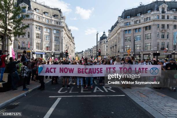 Environmental activists from Extinction Rebellion block Oxford Circus on the third day of the 'Impossible Rebellion', a new wave of protests and...