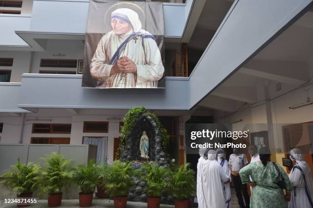 Nuns from Missionaries of Charity attend a special prayer to mark the 111th birth anniversary of Mother Teresa, near her tomb at the Mother House in...