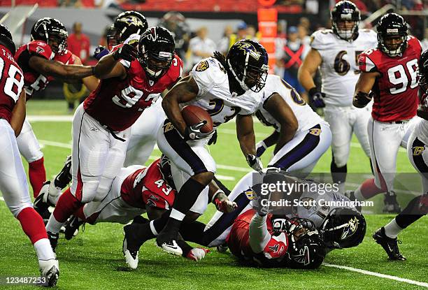 Damien Berry of the Baltimore Ravens carries the ball against the Atlanta Falcons during a preseason game at the Georgia Dome on September 1, 2011 in...