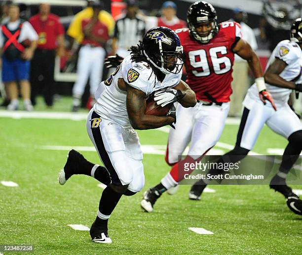 Damien Berry of the Baltimore Ravens carries the ball against the Atlanta Falcons during a preseason game at the Georgia Dome on September 1, 2011 in...