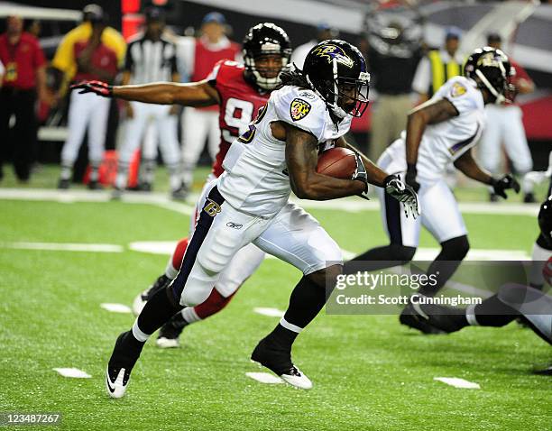 Damien Berry of the Baltimore Ravens carries the ball against the Atlanta Falcons during a preseason game at the Georgia Dome on September 1, 2011 in...