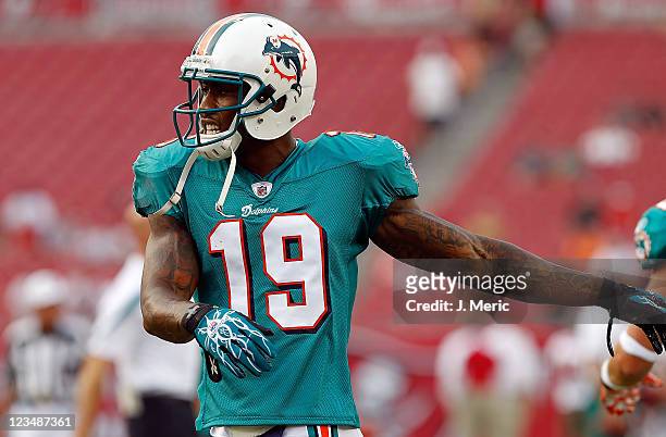 Receiver Brandon Marshall of the Miami Dolphins warms up just before the start of the preseason game against the Tampa Bay Buccaneers at Raymond...