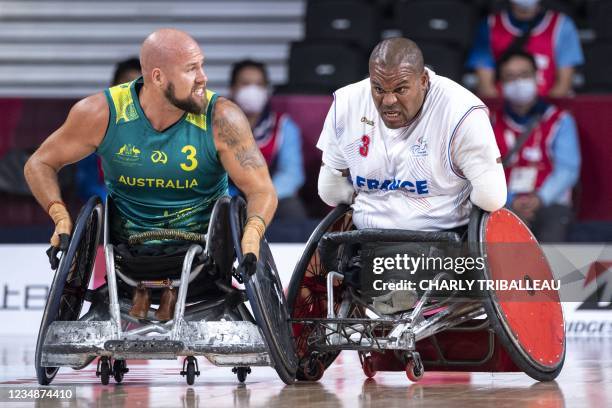 France's Cedric Nankin and Australia's Ryley Batt compete during the group A wheelchair rugby match between France and Australia during the Tokyo...